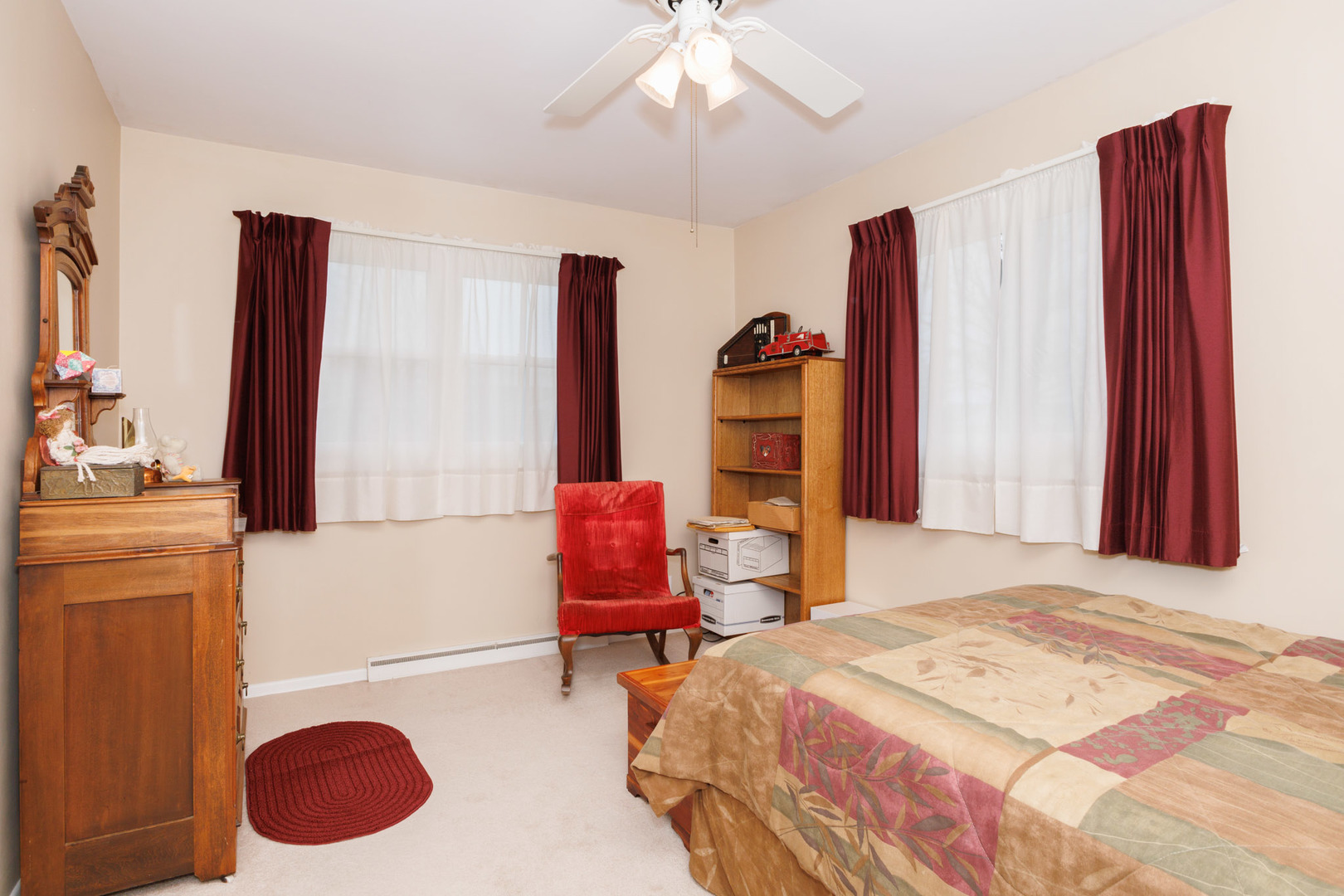 305 Granada Road Bloomington, IL 61701 - Photo 23 of 36 a bedroom with a bed dresser and a window