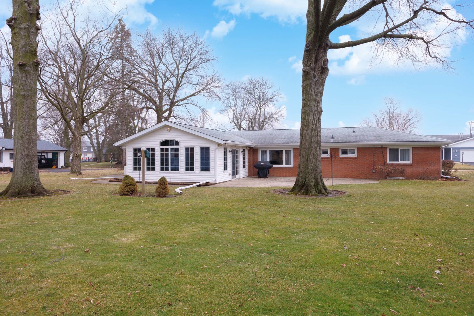 305 Granada Road Bloomington, IL 61701 - Photo 30 of 36 a front view of a house with a yard