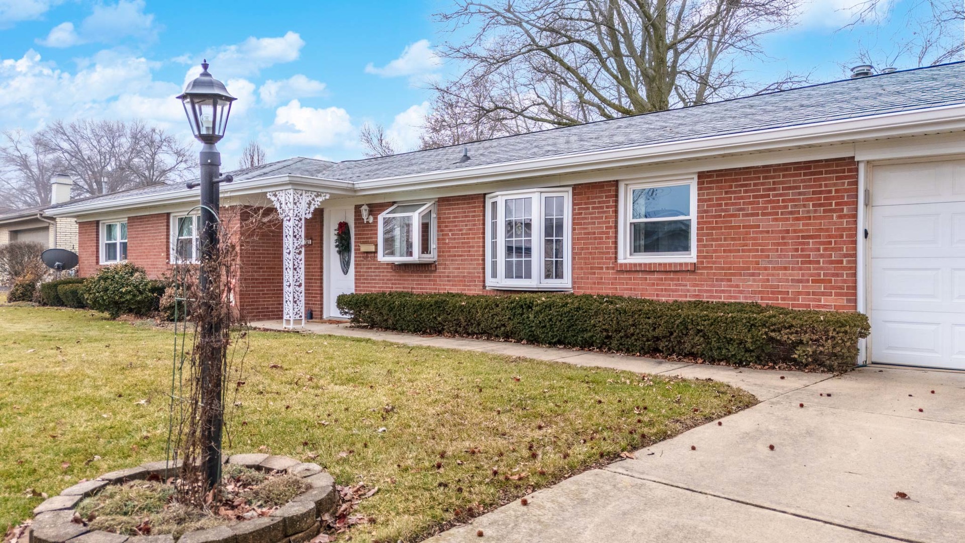 305 Granada Road Bloomington, IL 61701 - Photo 3 of 36 a front view of a house with a yard