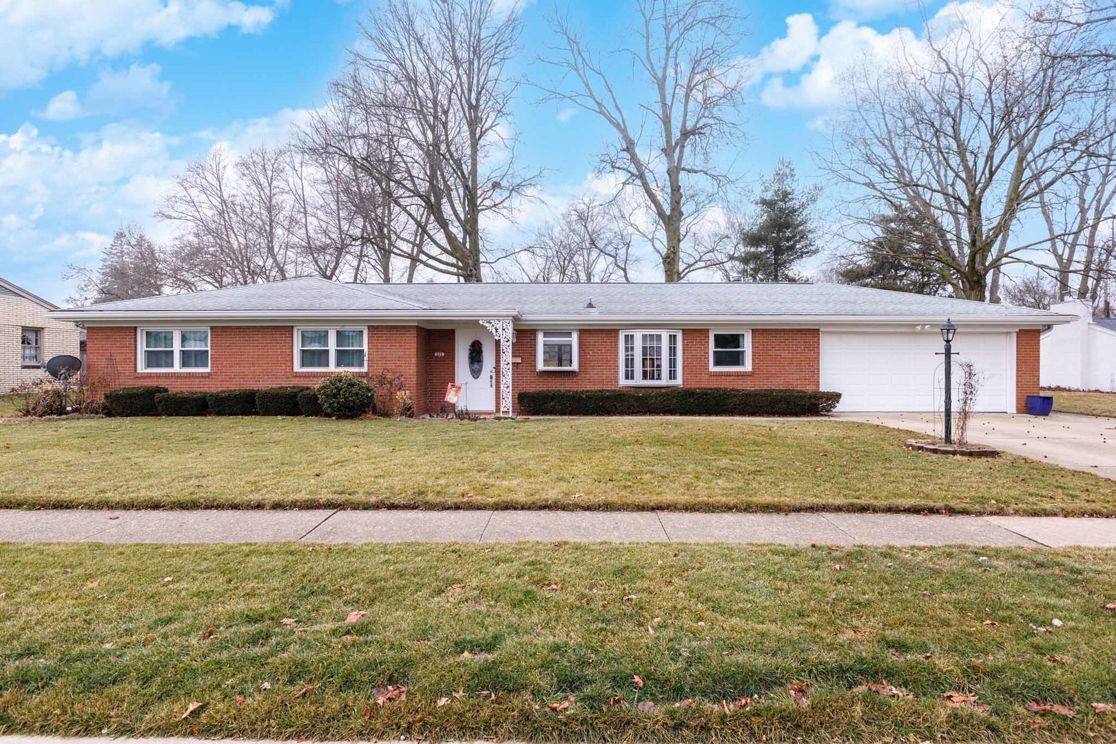 305 Granada Road Bloomington, IL 61701 - Photo 34 of 36 a front view of a house with a yard table and chairs