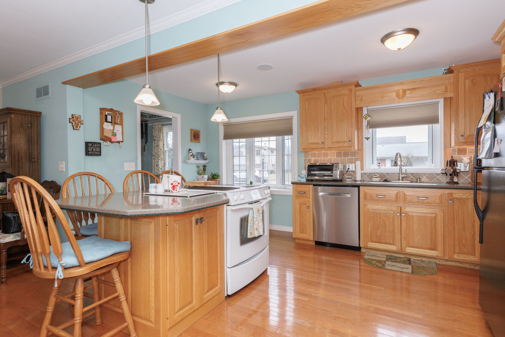 305 Granada Road Bloomington, IL 61701 - Photo 7 of 36 a kitchen with granite countertop a sink appliances cabinets and furniture