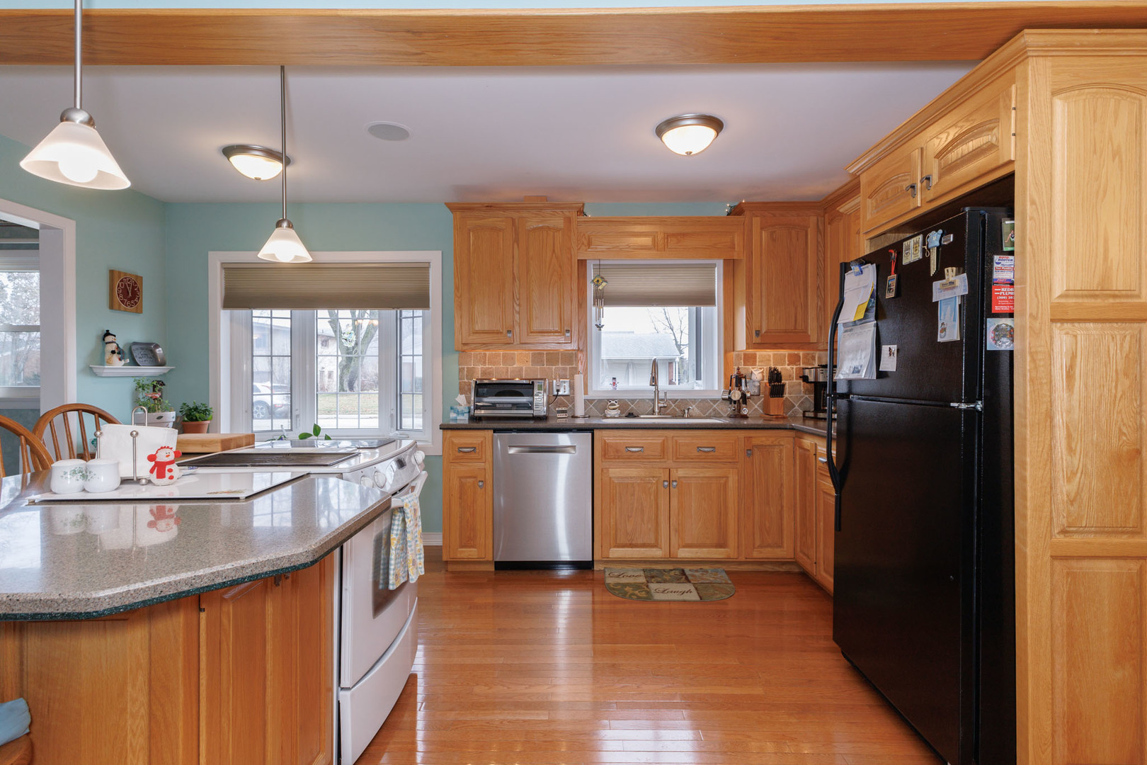 305 Granada Road Bloomington, IL 61701 - Photo 8 of 36 a kitchen with counter top space and appliances