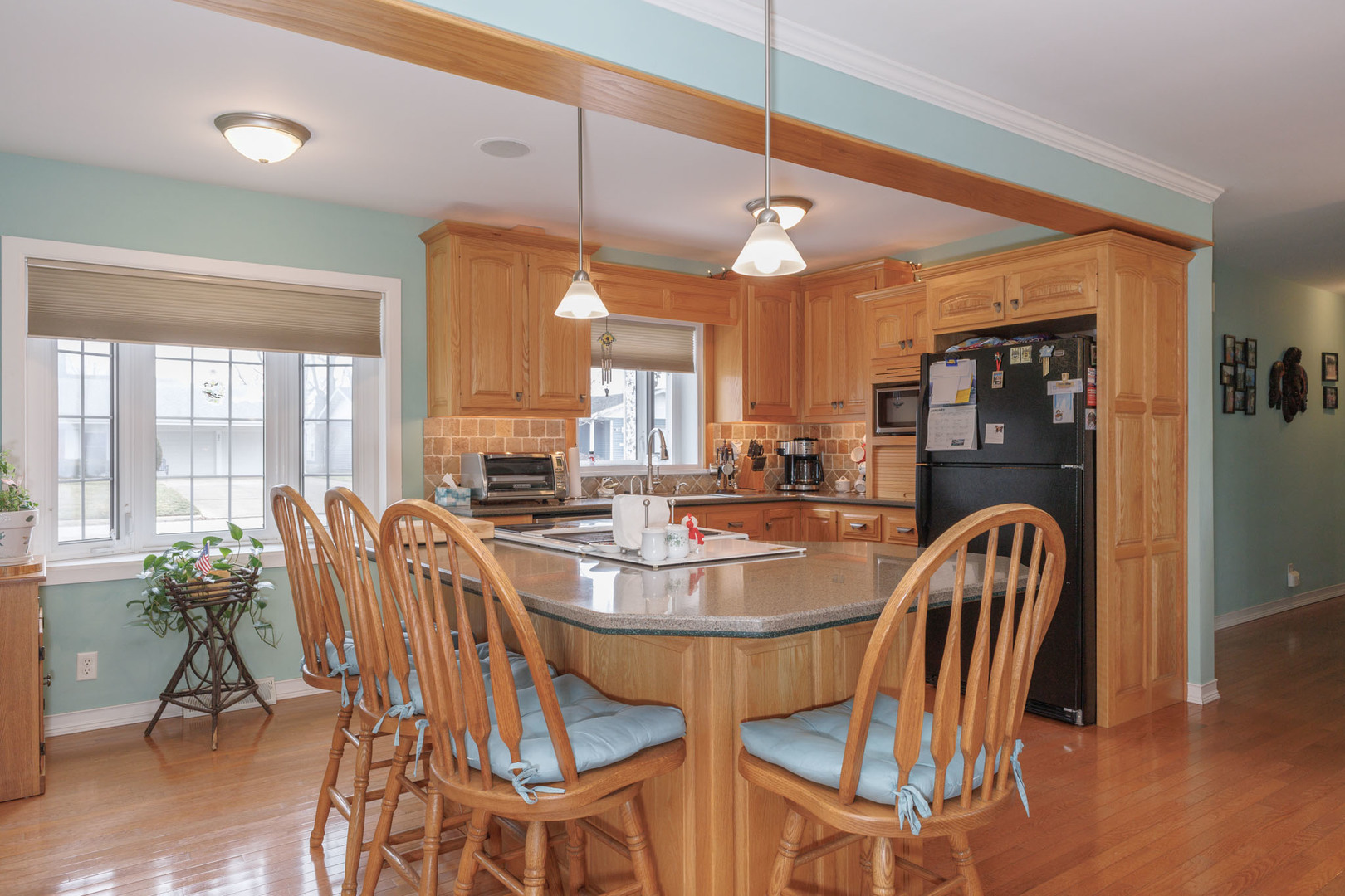 305 Granada Road Bloomington, IL 61701 - Photo 9 of 36 a dining room with furniture and wooden floor