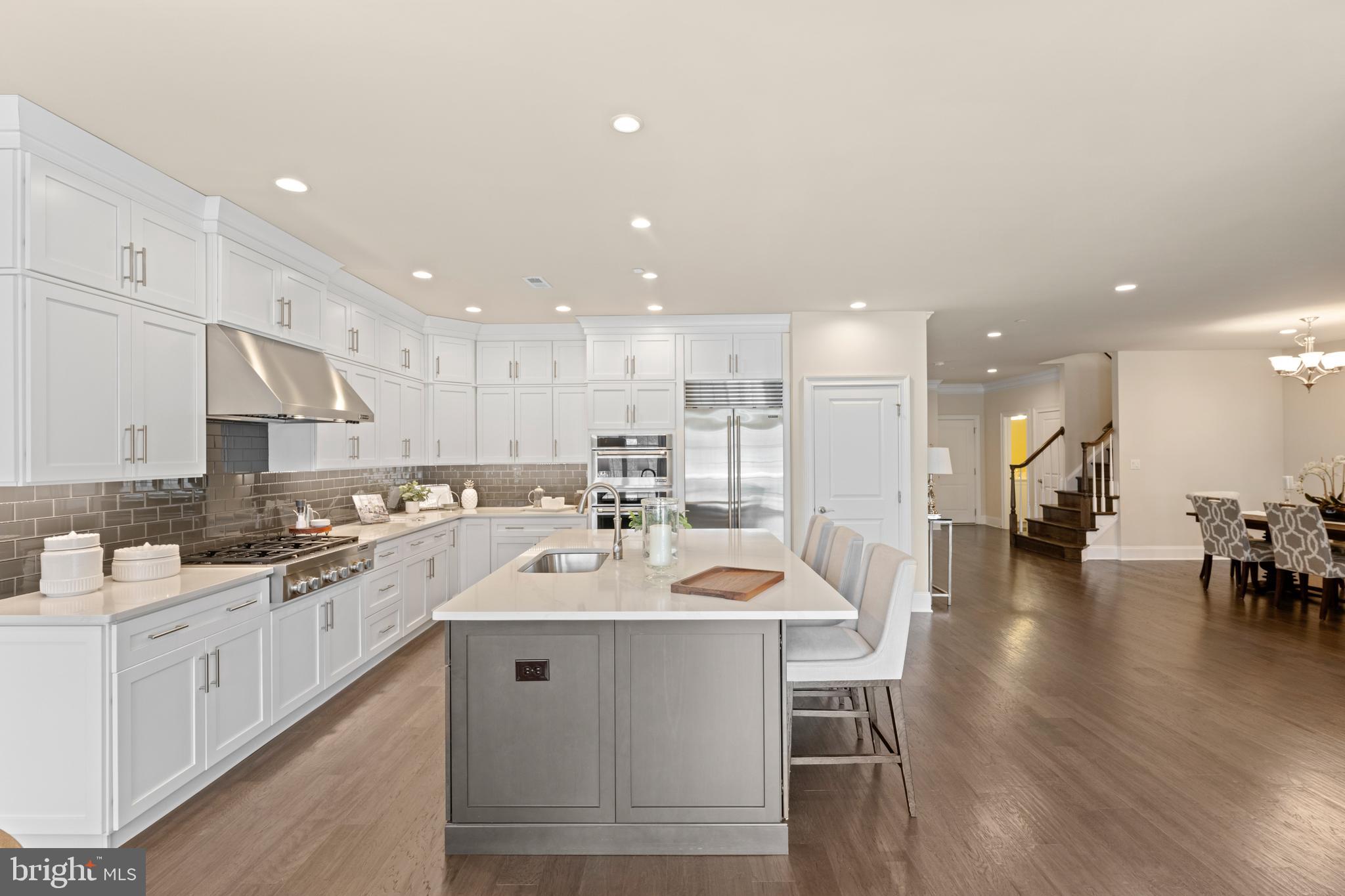 3860 Meadow View Farm Road Newtown Square, PA 19073 - Photo 11 of 40 a kitchen with a sink stainless steel appliances and white cabinets