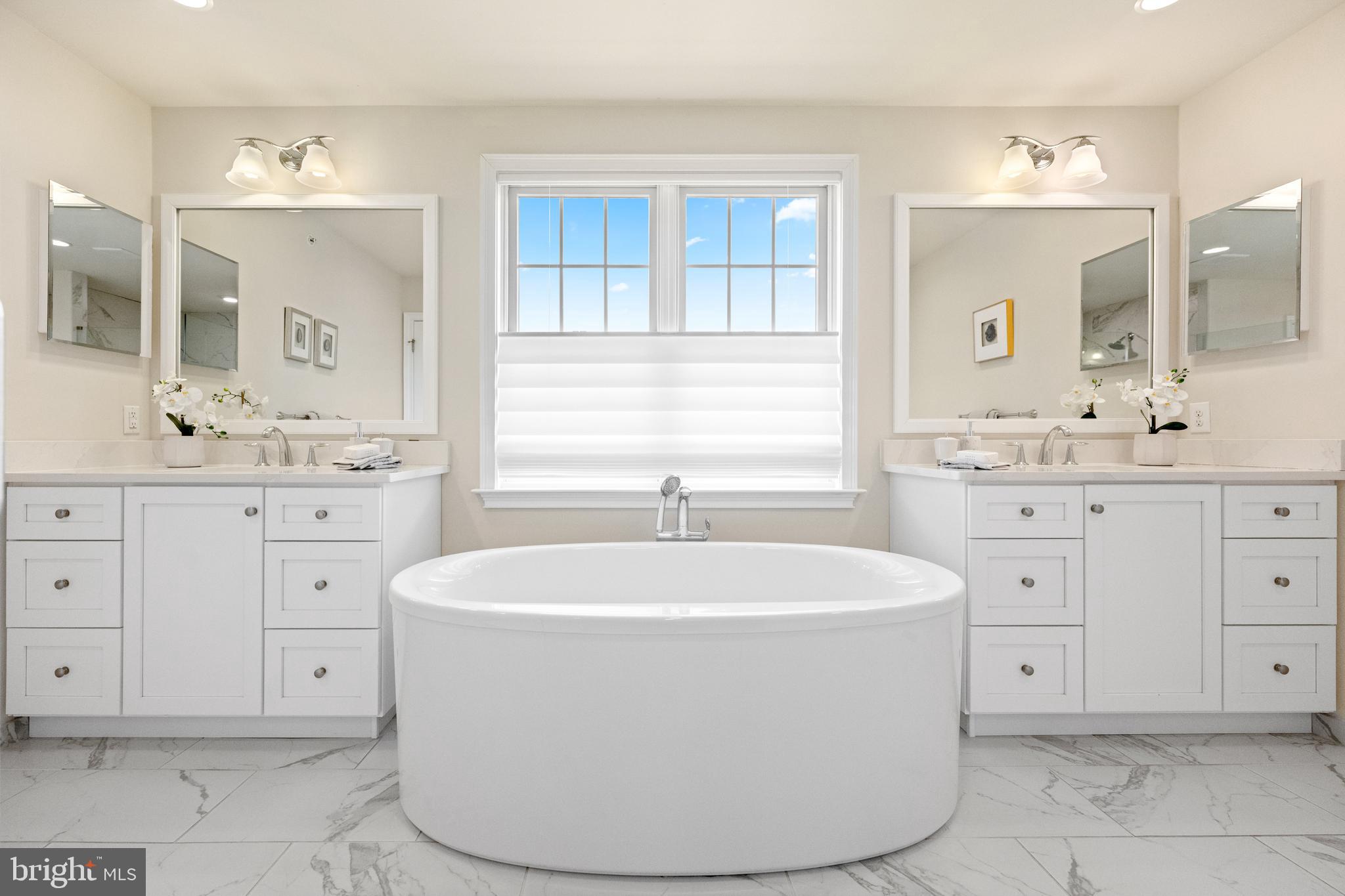 3860 Meadow View Farm Road Newtown Square, PA 19073 - Photo 27 of 40 a spacious bathroom with a double vanity sink mirror and bathtub