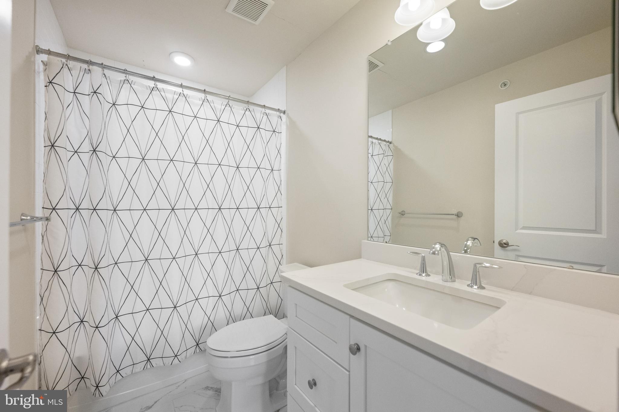 3860 Meadow View Farm Road Newtown Square, PA 19073 - Photo 33 of 40 a bathroom with a granite countertop sink and a mirror