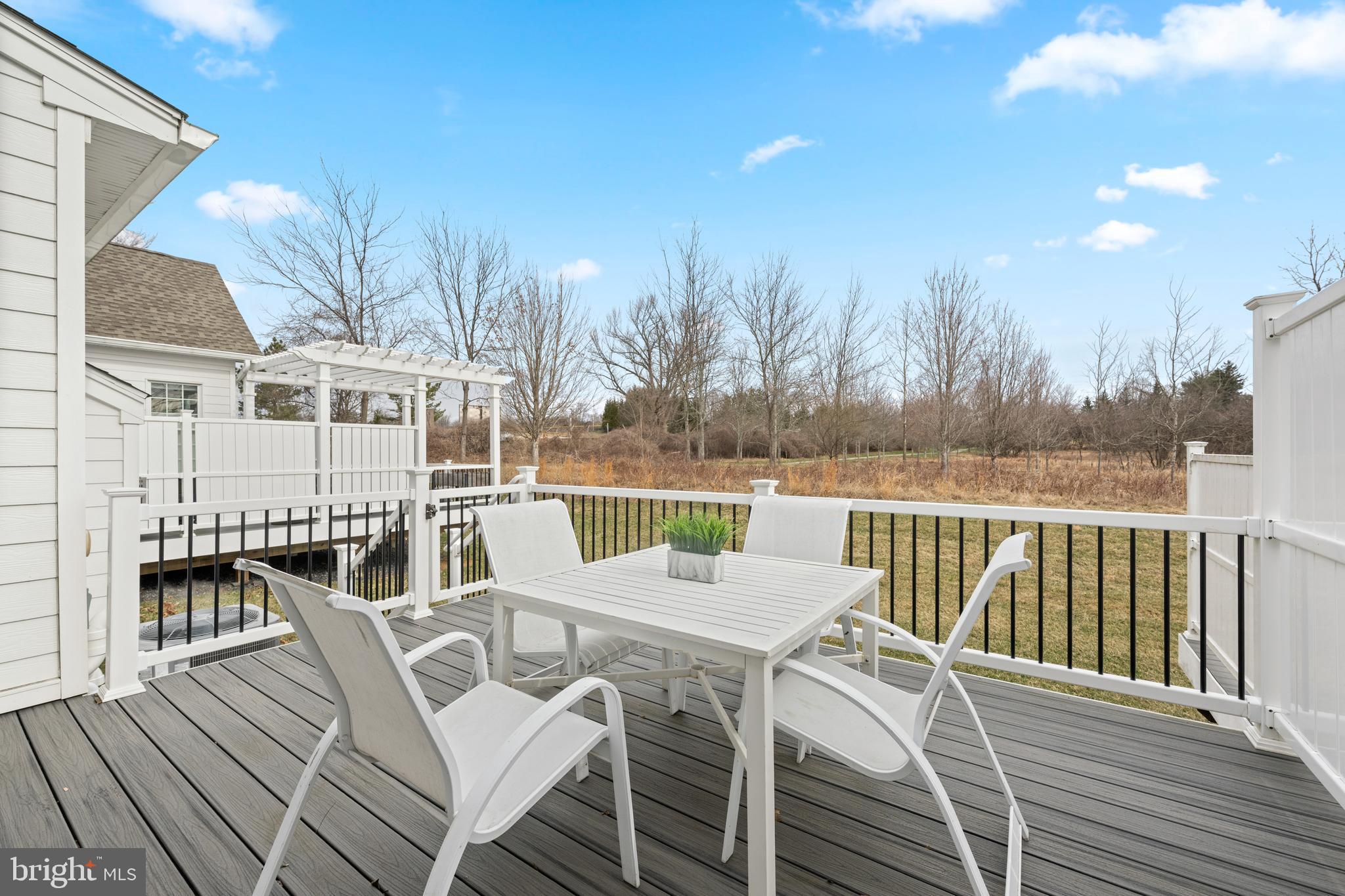 3860 Meadow View Farm Road Newtown Square, PA 19073 - Photo 4 of 40 a view of a chairs and table on the wooden deck