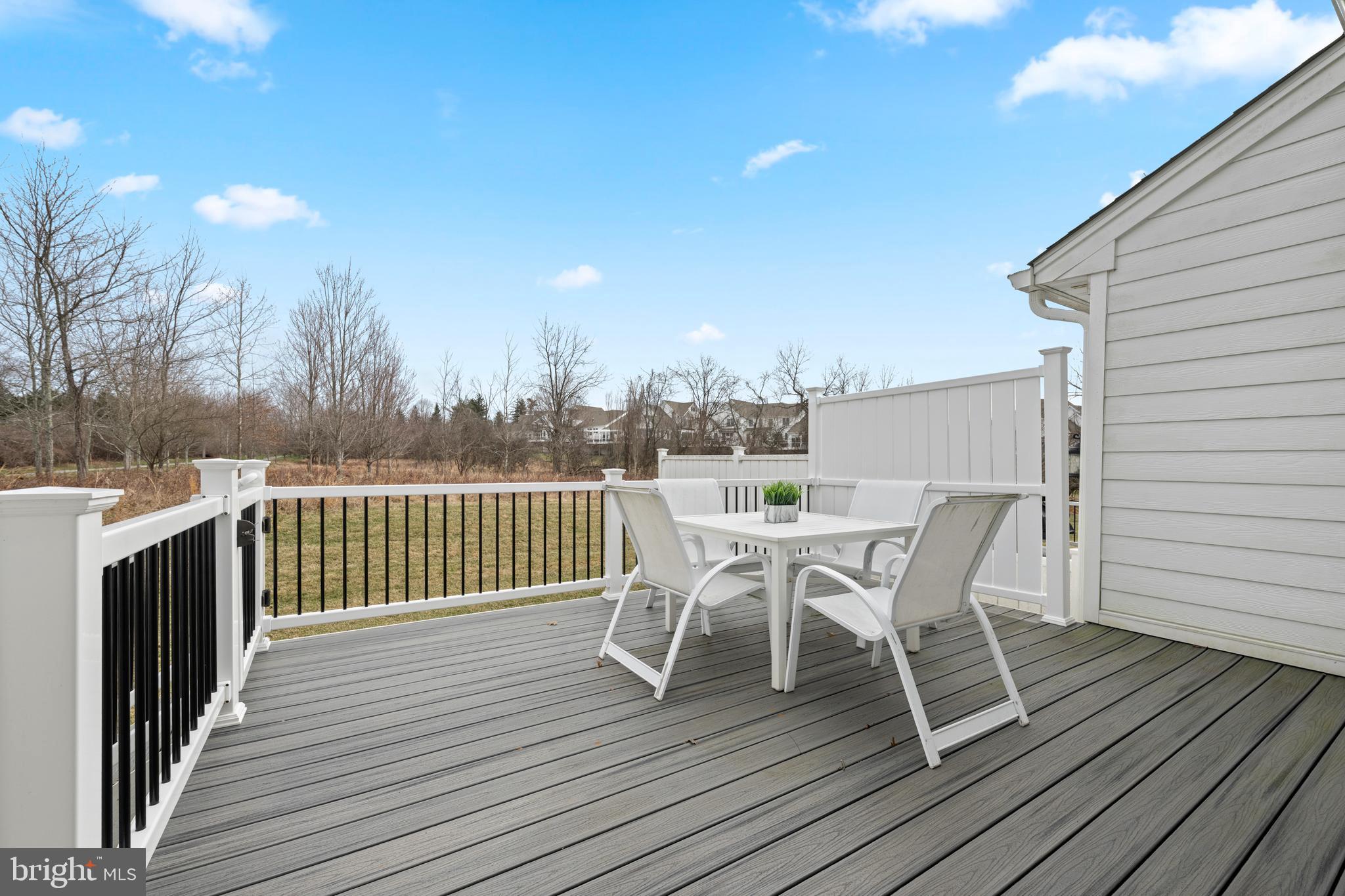 3860 Meadow View Farm Road Newtown Square, PA 19073 - Photo 5 of 40 a view of a roof deck with table and chairs