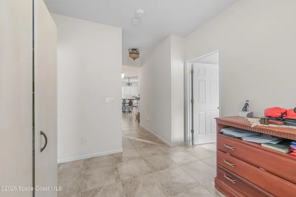 a view of a storage and utility room with closet