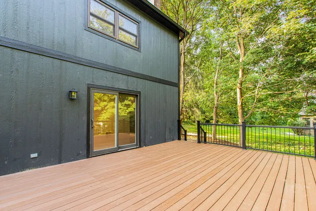 a bedroom with a bed and a balcony view