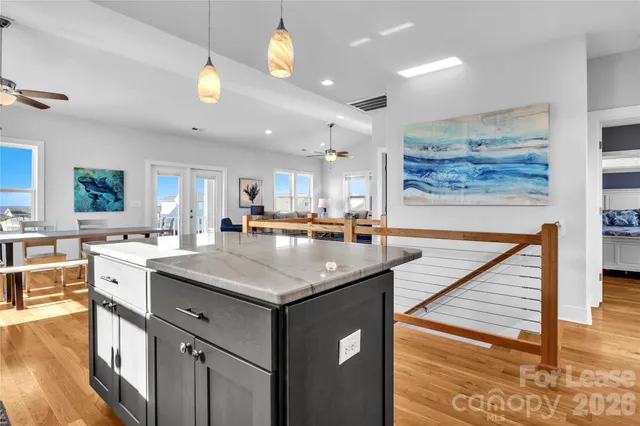 a kitchen with a sink a counter space and appliances