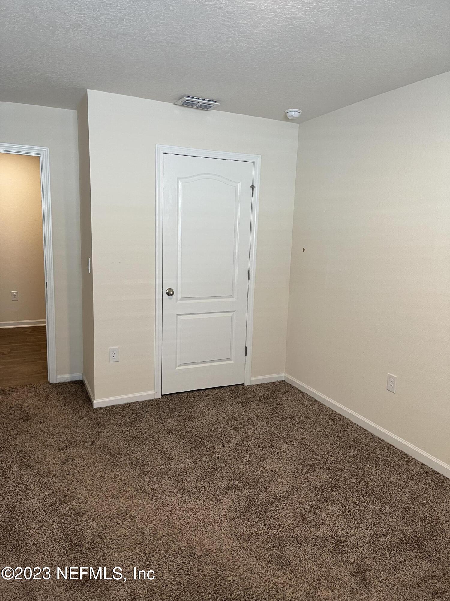 581 Morgans Treasure Road St. Augustine, FL 32084 - Photo 12 of 20 an empty room with closet area