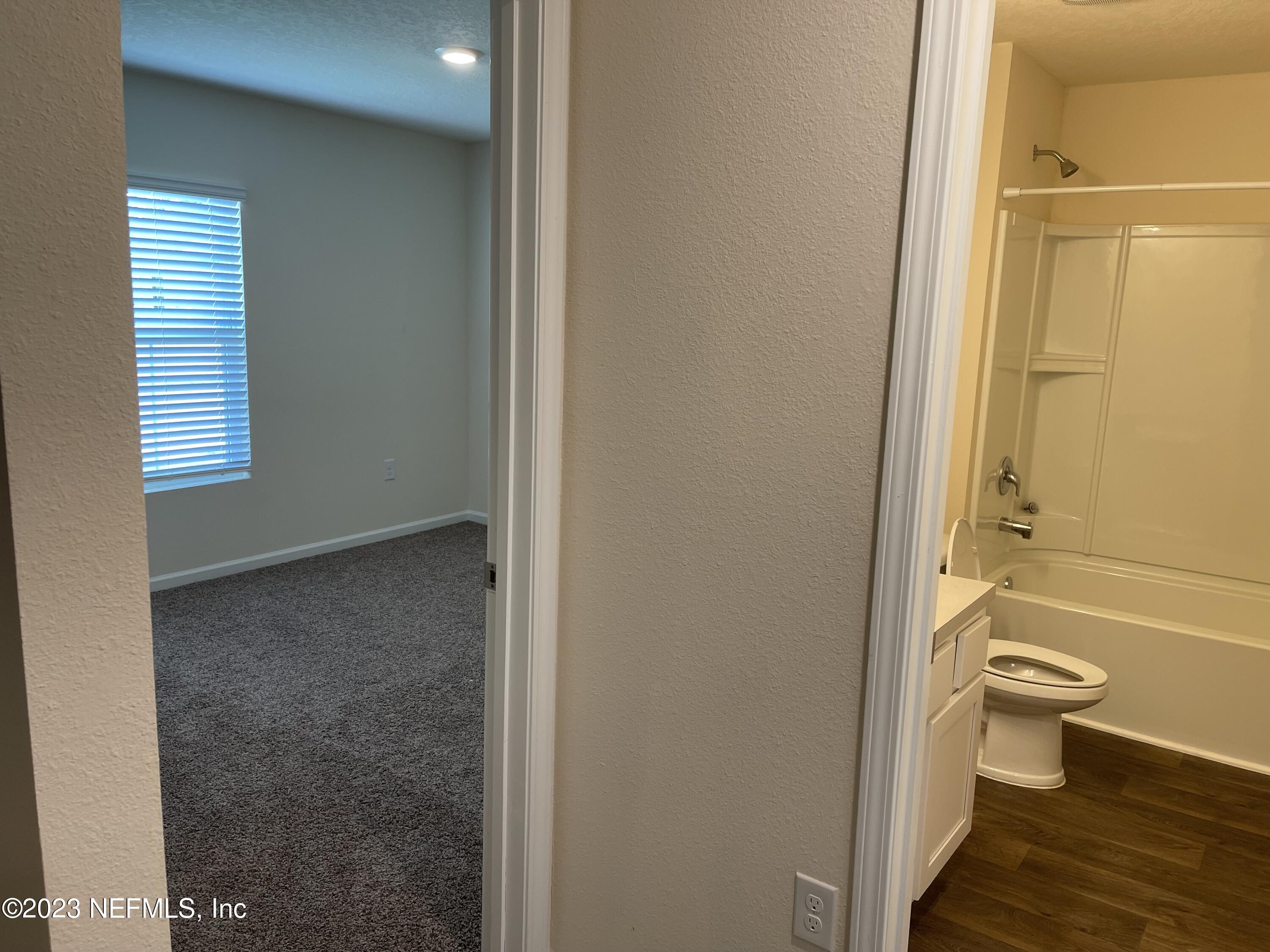 581 Morgans Treasure Road St. Augustine, FL 32084 - Photo 13 of 20 a bathroom with a toilet and a shower