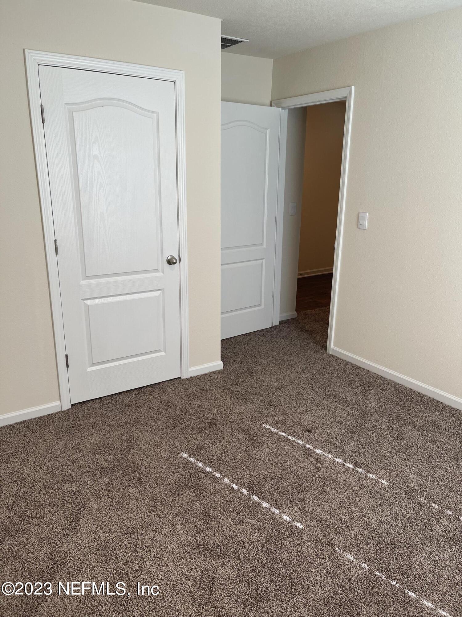 581 Morgans Treasure Road St. Augustine, FL 32084 - Photo 18 of 20 a view of an empty room