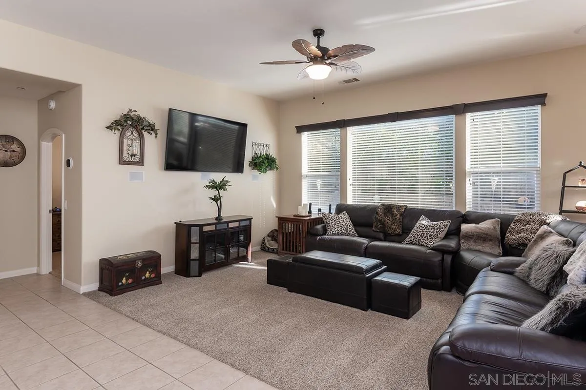 16333 Deer Ridge Road San Diego, CA 92127 - Photo 12 of 43 a living room with furniture and a flat screen tv