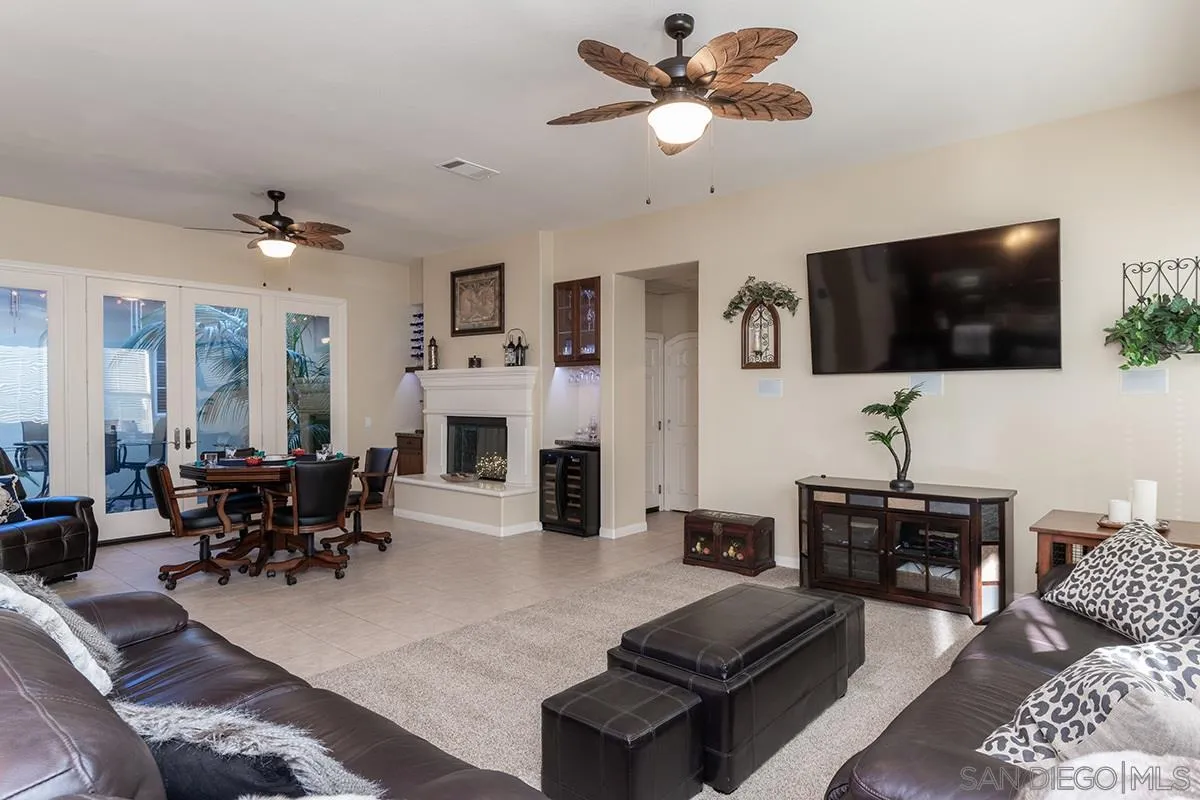 16333 Deer Ridge Road San Diego, CA 92127 - Photo 16 of 43 a living room with furniture and a flat screen tv