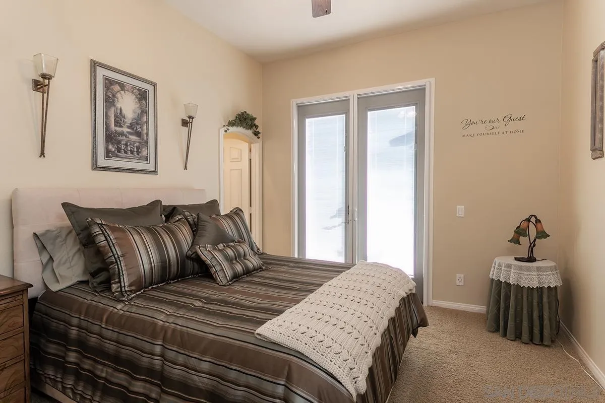 16333 Deer Ridge Road San Diego, CA 92127 - Photo 17 of 43 a bedroom with bed and window