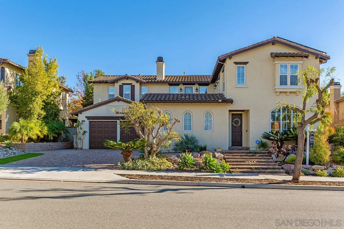 16333 Deer Ridge Road San Diego, CA 92127 - Photo 2 of 43 a front view of a house with a yard