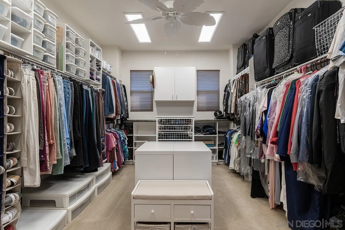 16333 Deer Ridge Road San Diego, CA 92127 - Photo 26 of 43 a walk in closet with clothes
