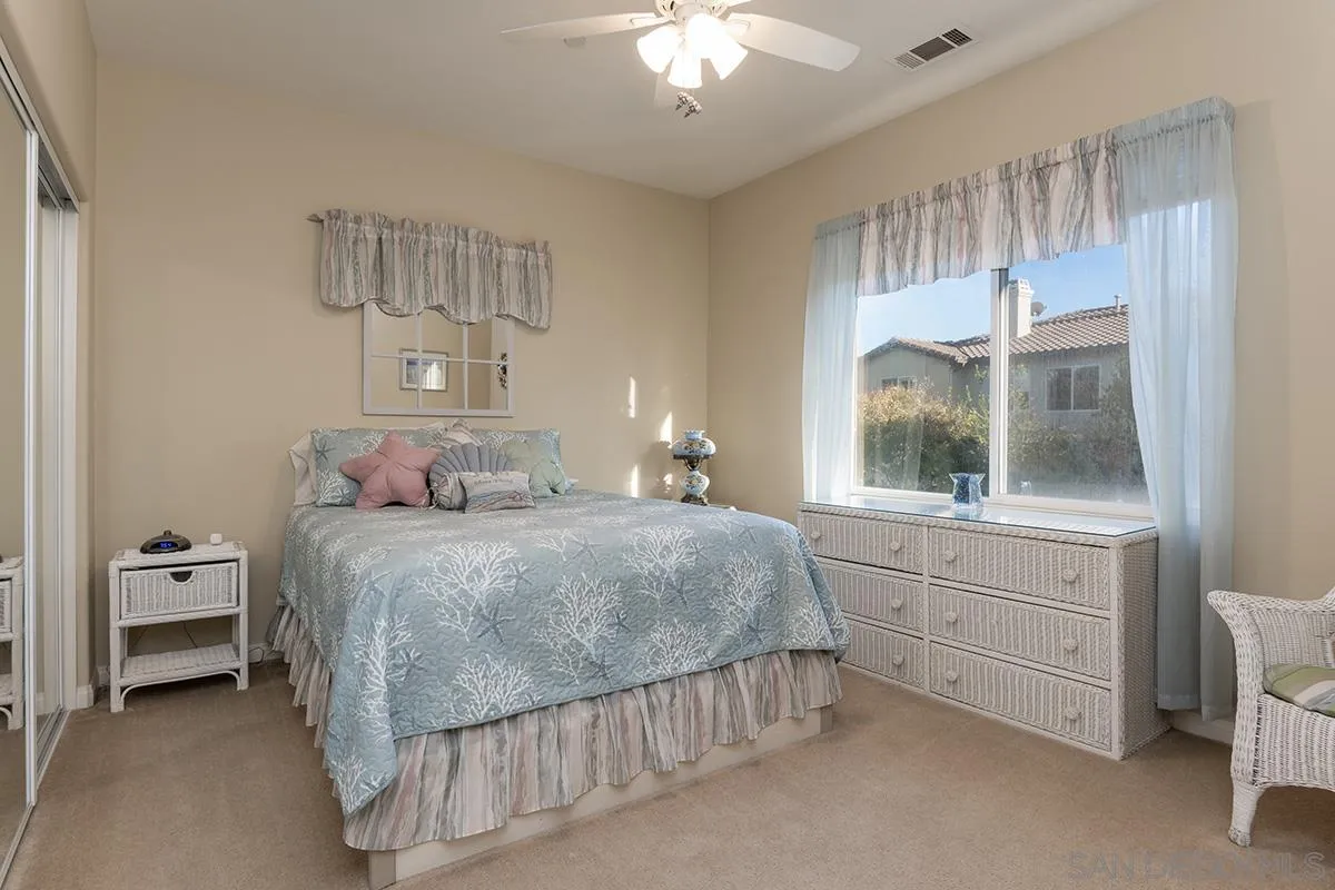 16333 Deer Ridge Road San Diego, CA 92127 - Photo 30 of 43 a bedroom with a bed and a window