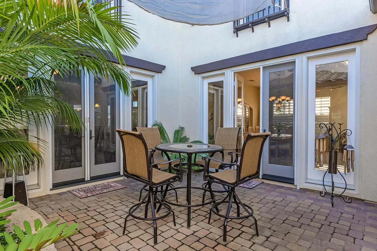 16333 Deer Ridge Road San Diego, CA 92127 - Photo 3 of 43 a view of a dining room with a table and chairs