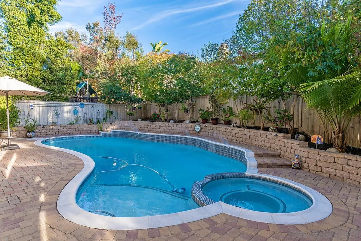 16333 Deer Ridge Road San Diego, CA 92127 - Photo 39 of 43 a view of a swimming pool with a yard