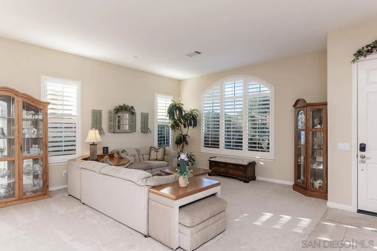 16333 Deer Ridge Road San Diego, CA 92127 - Photo 5 of 43 a living room with furniture and a large window
