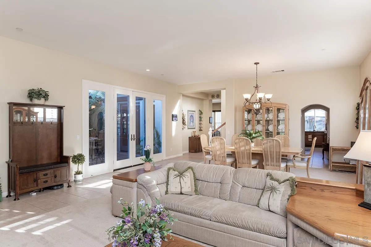 16333 Deer Ridge Road San Diego, CA 92127 - Photo 6 of 43 a living room with furniture and a flat screen tv