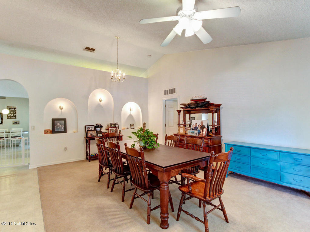 3187 Shadow Creek Road Jacksonville, FL 32226 - Photo 3 of 24 a view of a dining room and livingroom with furniture