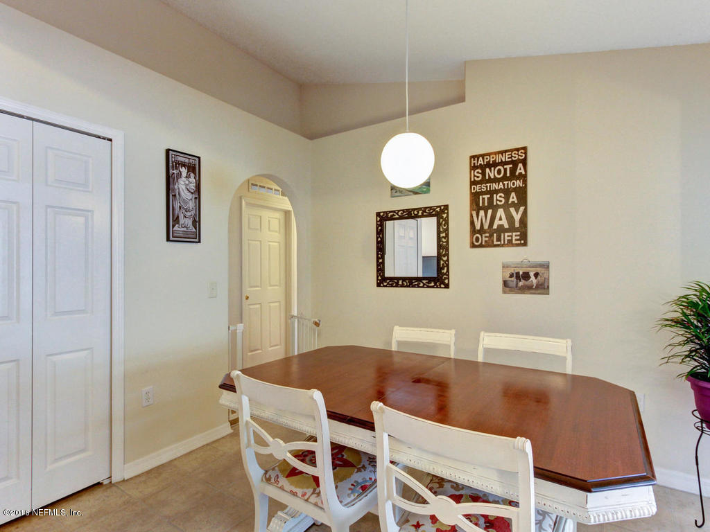 3187 Shadow Creek Road Jacksonville, FL 32226 - Photo 8 of 24 a view of a dining room with furniture