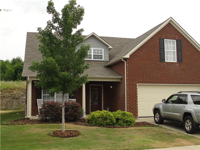 1025 Fulman Road Hendersonville, TN 37075 - Photo 1 of 11 a front view of a house with a garden