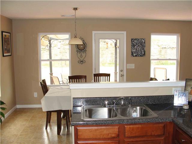 1025 Fulman Road Hendersonville, TN 37075 - Photo 6 of 11 a kitchen with a table chairs and window