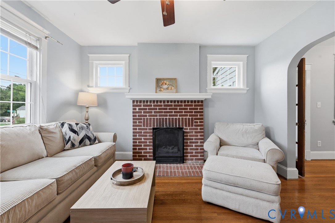 8077 Signal Hill Road Mechanicsville, VA 23111 - Photo 5 of 24 Living area featuring a prominent red brick firepl