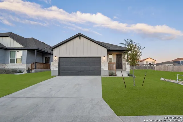 a view of a house with a back yard