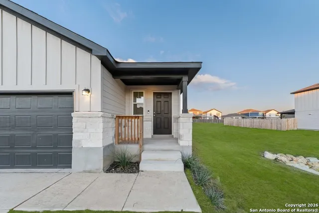 a view of a back yard of the house