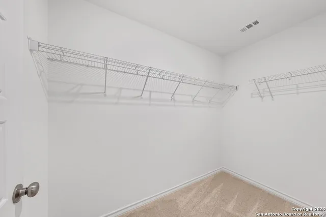 a view of a room with racks on the wall