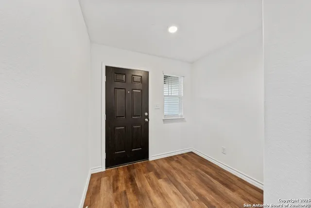 a bedroom with a bed and cabinet