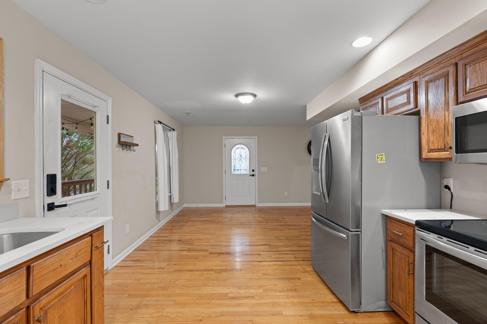 439 Town Creek Road Benton, TN 37307 - Photo 12 of 30 a view of a kitchen with a sink and a refrigerator