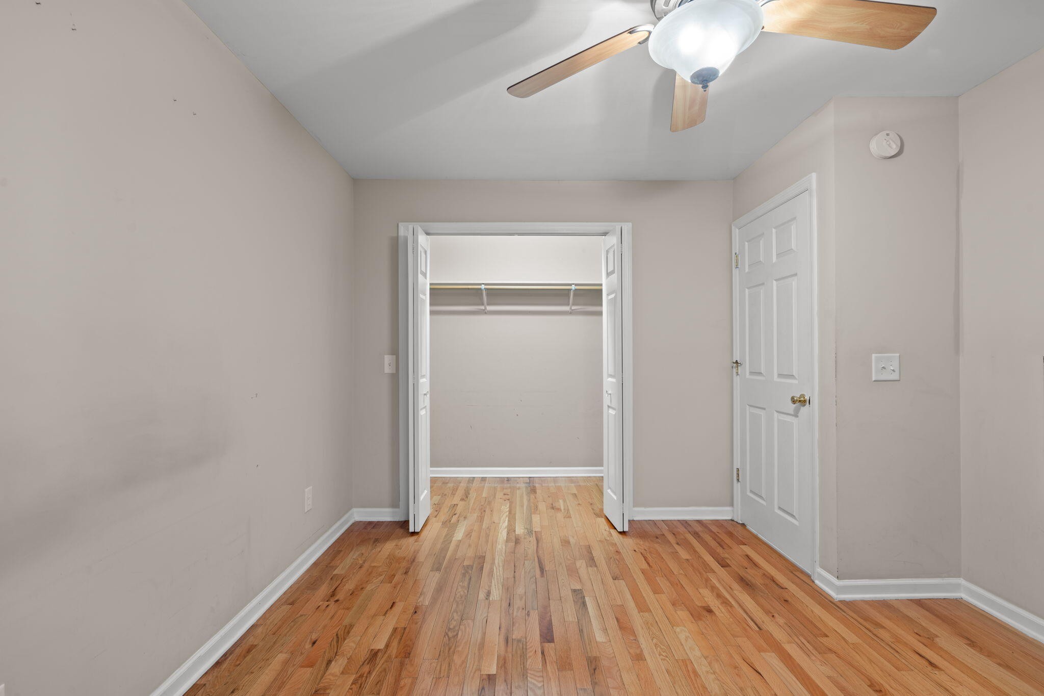 439 Town Creek Road Benton, TN 37307 - Photo 14 of 30 wooden floor in an empty room with a window