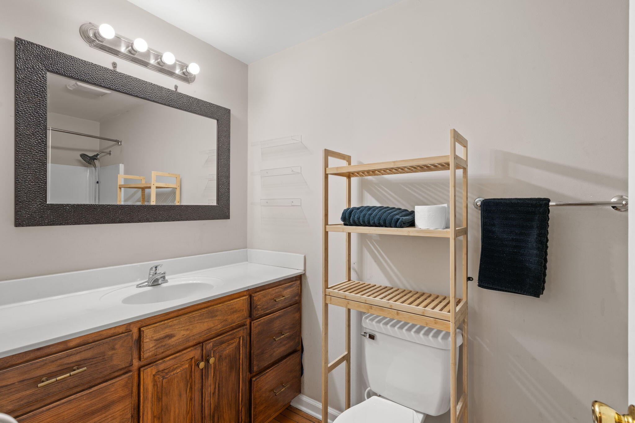 439 Town Creek Road Benton, TN 37307 - Photo 16 of 30 a bathroom with a sink a light fixture and a mirror