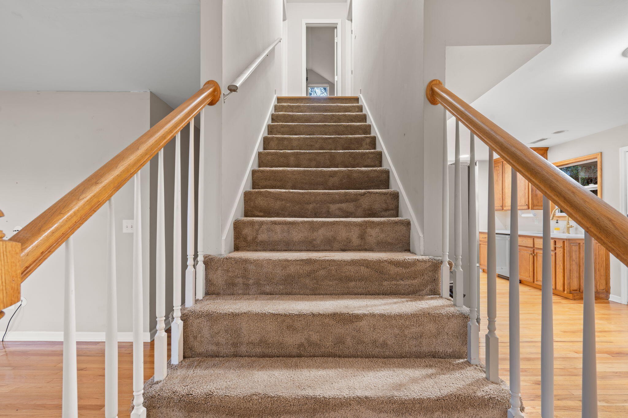 439 Town Creek Road Benton, TN 37307 - Photo 18 of 30 a view of staircase with wooden floor and white walls