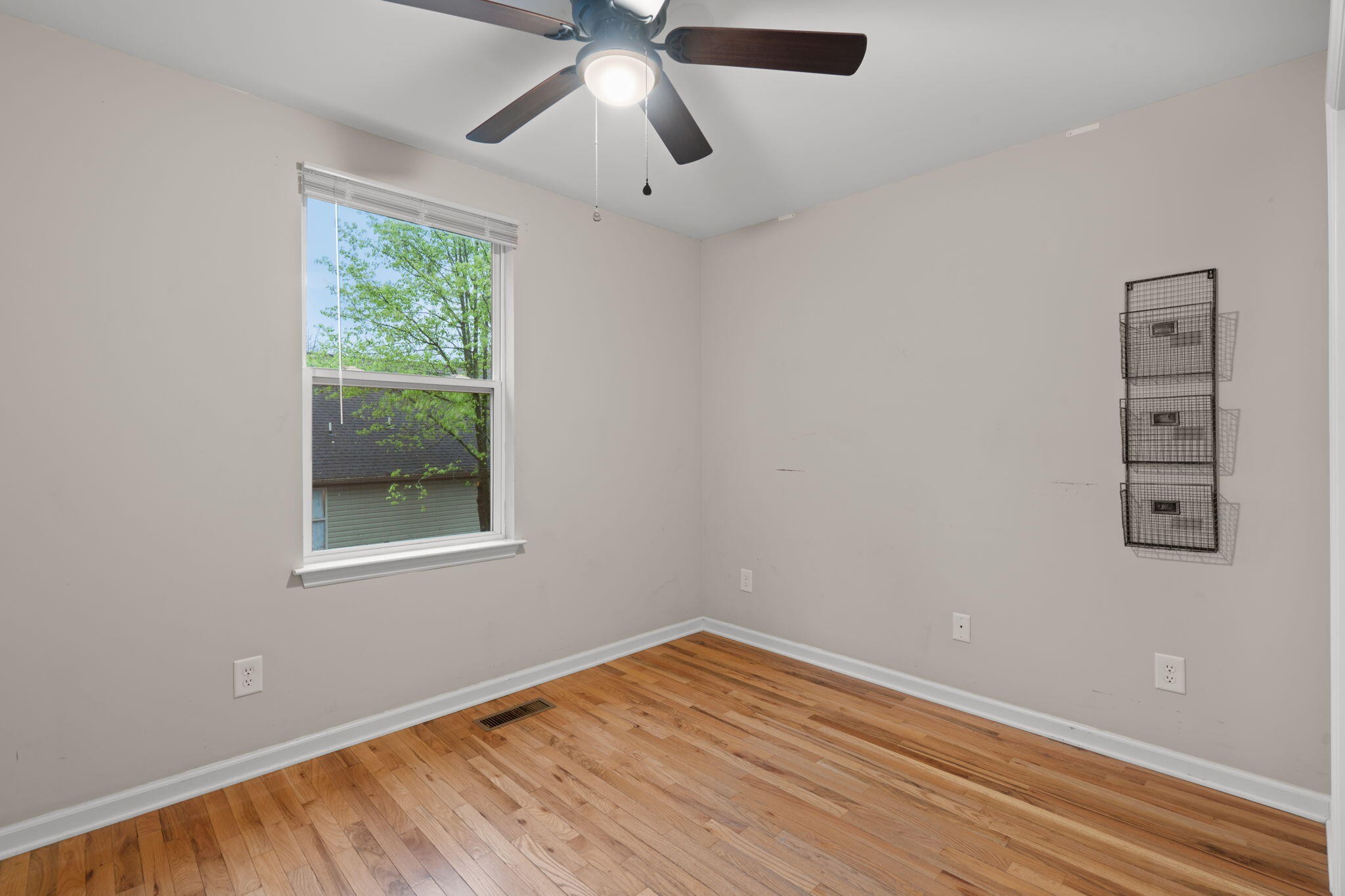 439 Town Creek Road Benton, TN 37307 - Photo 19 of 30 a view of empty room with wooden floor and fan