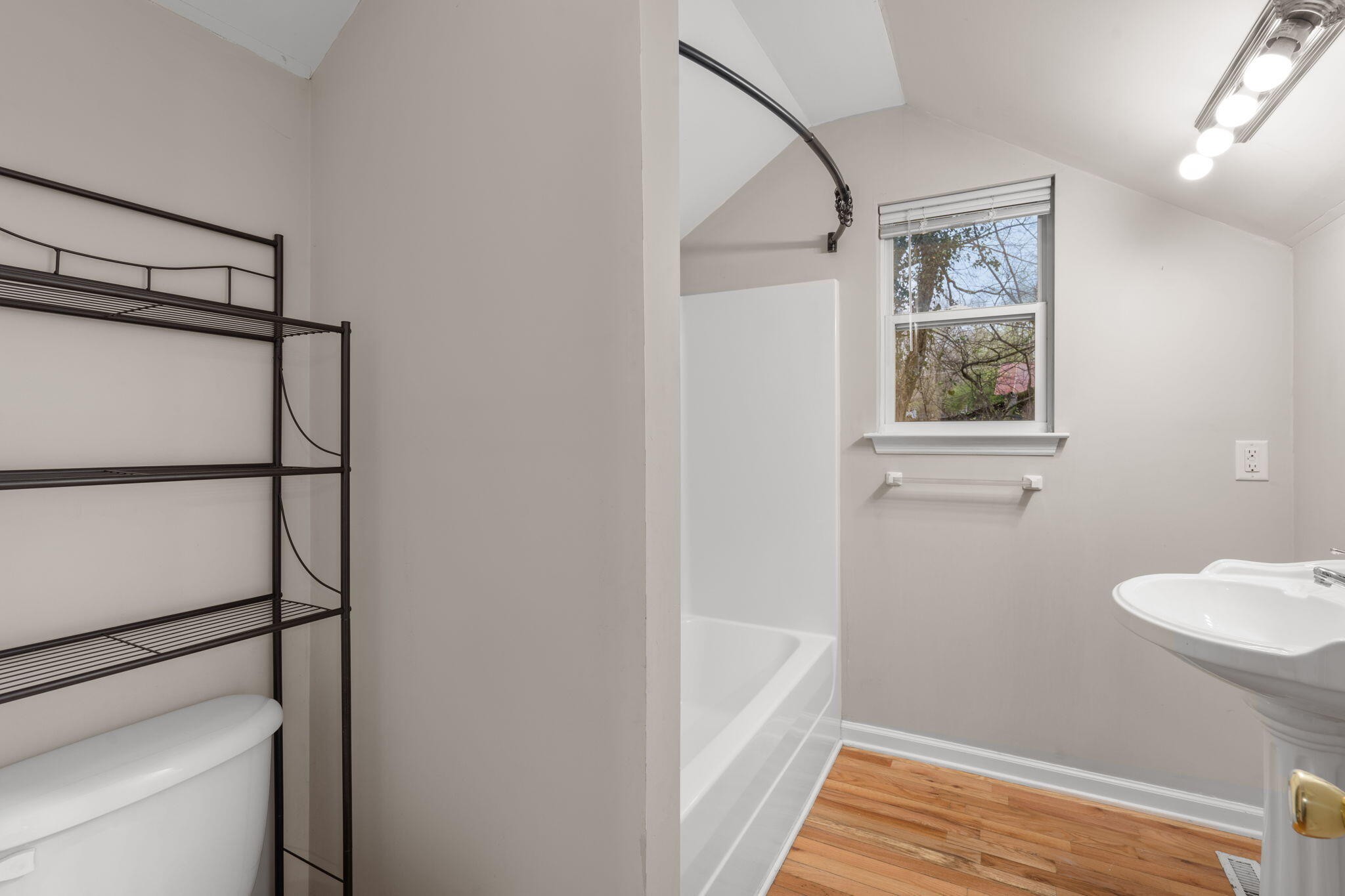 439 Town Creek Road Benton, TN 37307 - Photo 21 of 30 a bathroom with a bathtub and shower