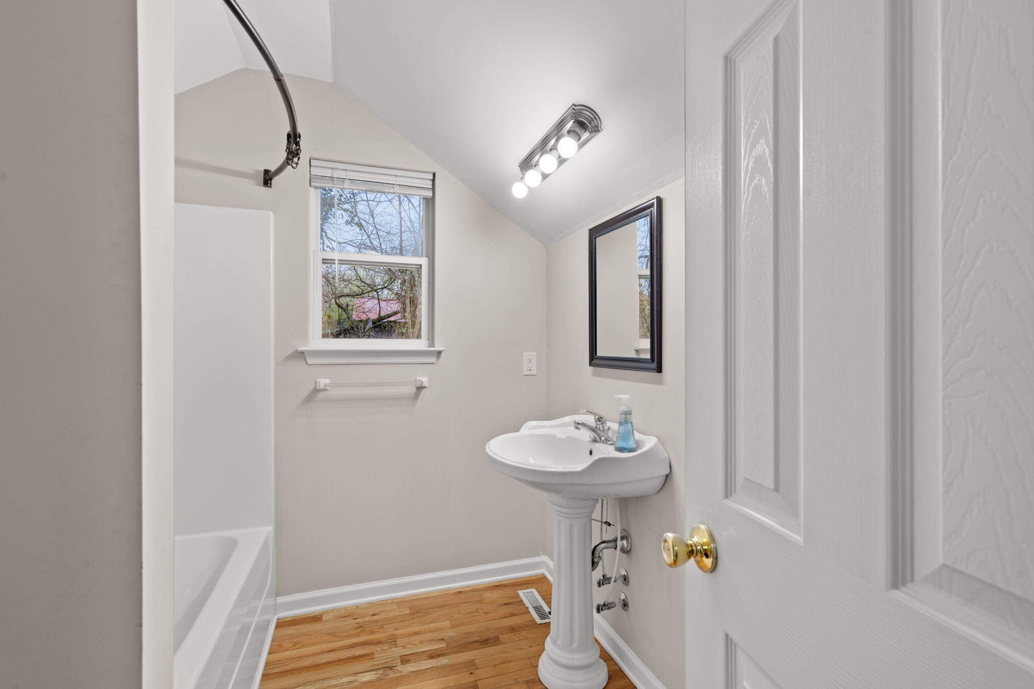 439 Town Creek Road Benton, TN 37307 - Photo 22 of 30 a bathroom with a sink toilet and shower