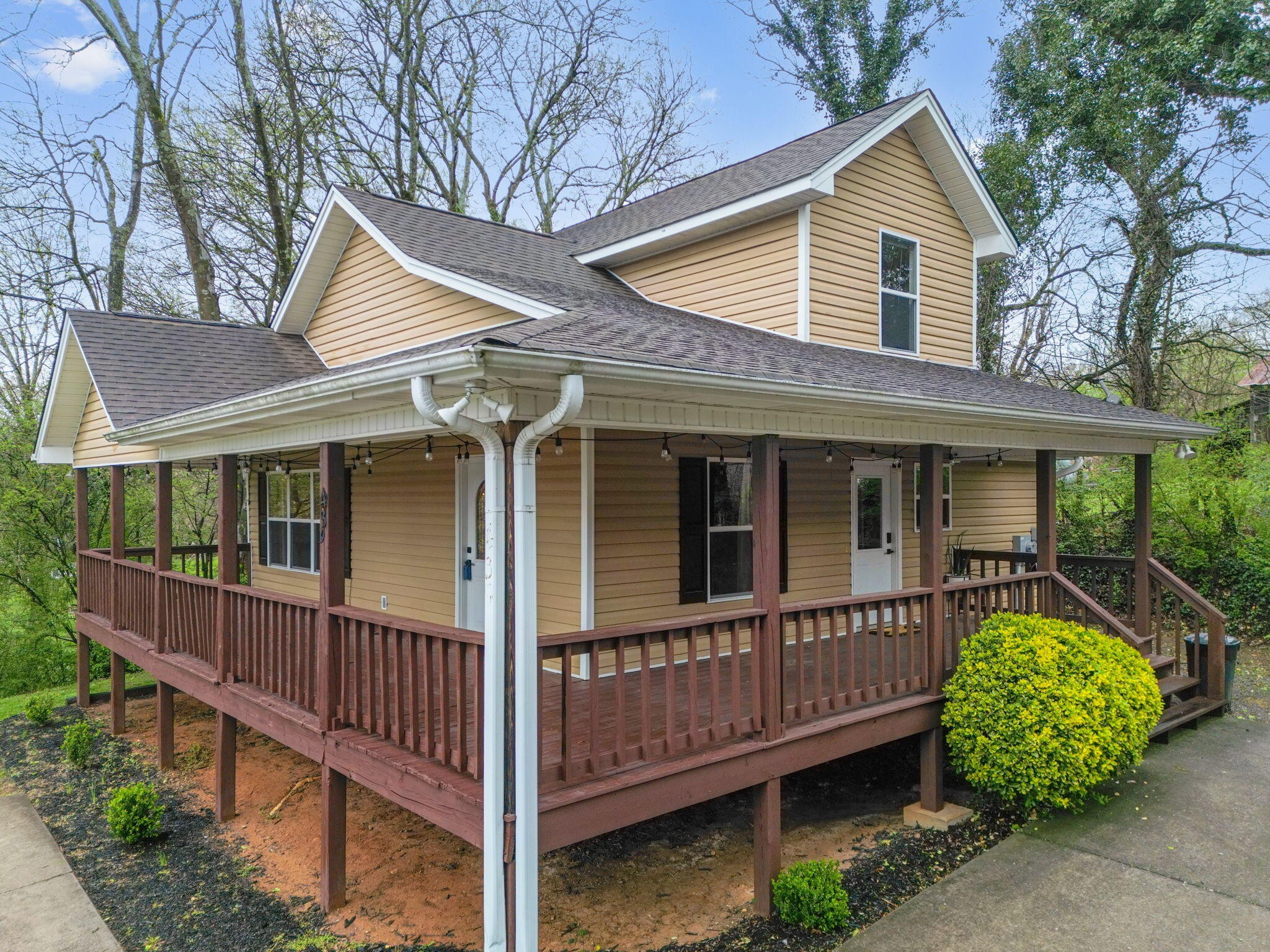 439 Town Creek Road Benton, TN 37307 - Photo 4 of 30 a view of a house with a yard and deck
