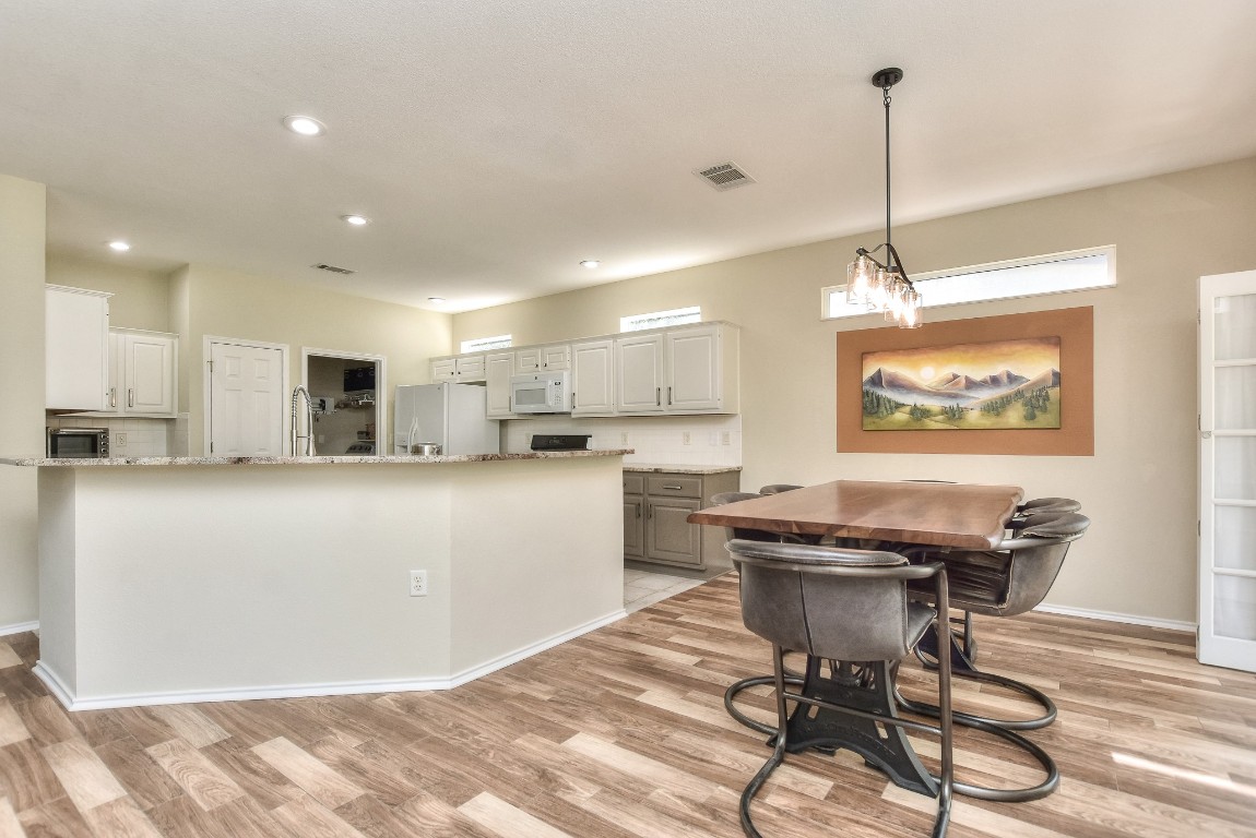116 Dandelion Drive Georgetown, TX 78633 - Photo 31 of 31 Kitchen and dining area flowing with the open floor plan
