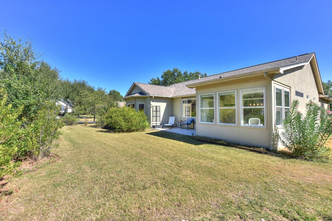 116 Dandelion Drive Georgetown, TX 78633 - Photo 27 of 31 Rear view of property with sunroom and pation