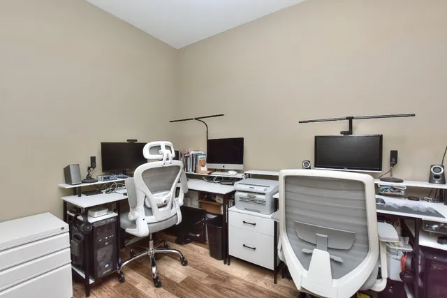 a workspace with furniture and wooden floor