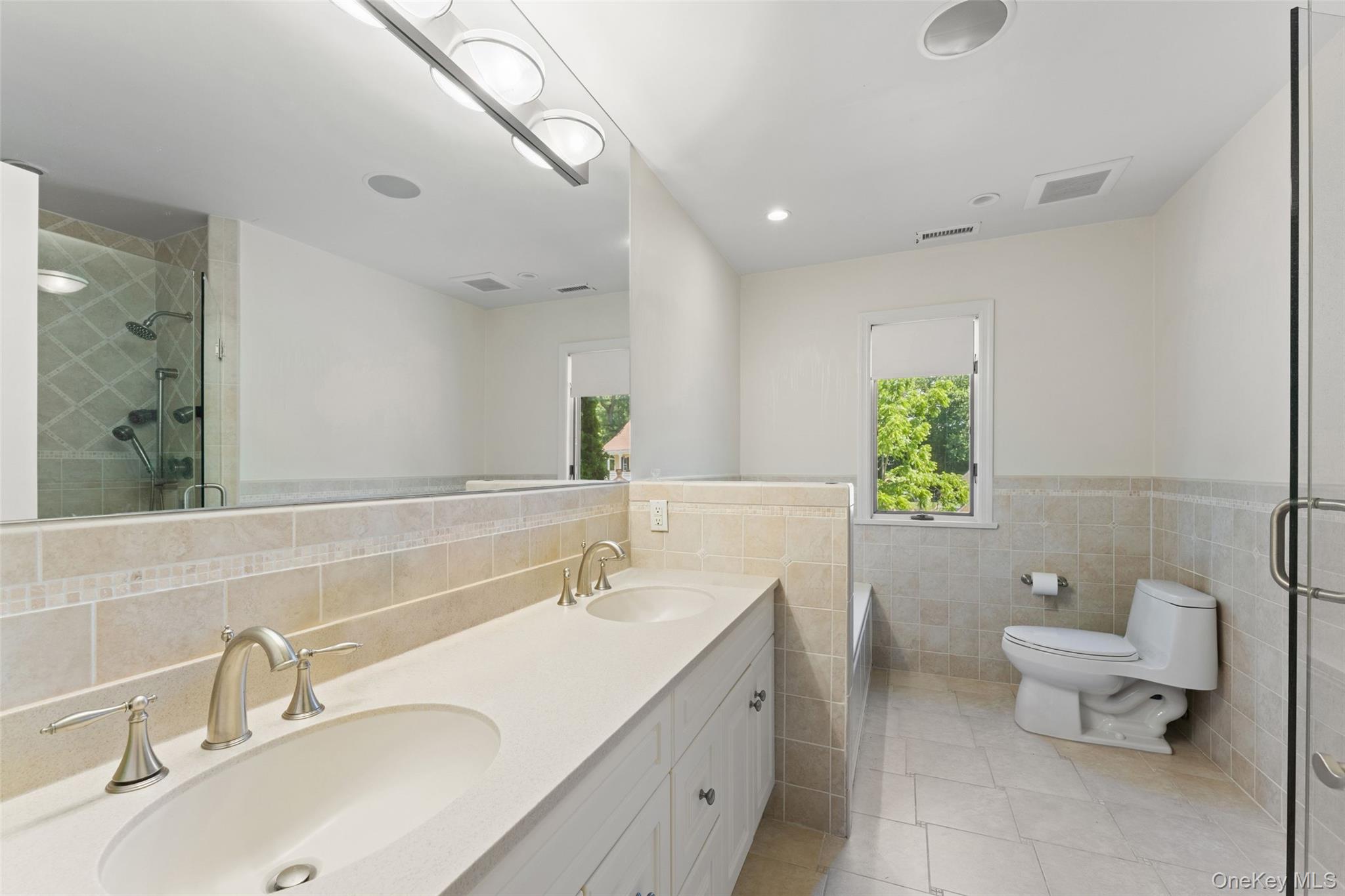 6 Magnetti Circle Mamaroneck, NY 10543 - Photo 19 of 24 a bathroom with a toilet sink and mirror