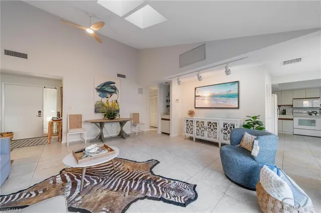 a living room with furniture or couch and a potted plant